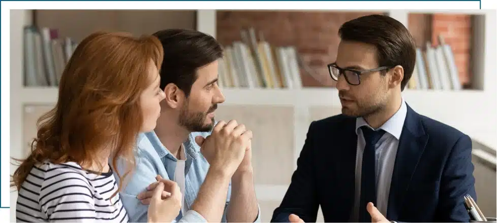 A couple having a discussion with a disability lawyer