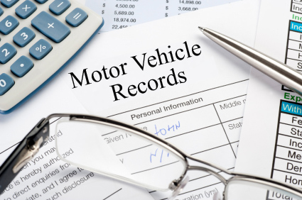 A paper with motor vehicle records written on it